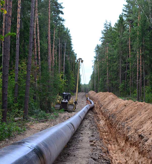 a pipe running along dug out land
