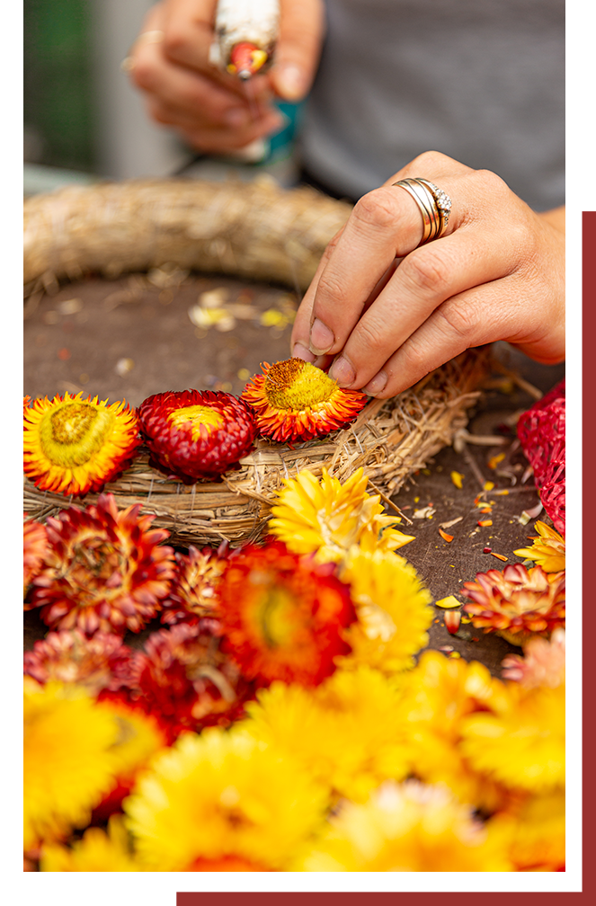 a woman decorating a basket
